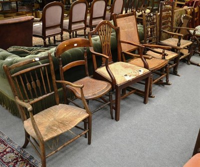 Lot 1590 - ^ A 19th century mahogany framed bergere chair (a.f.), three rush seated chairs, cane seated...