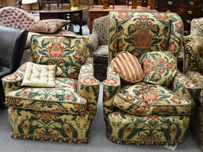 Lot 1595 - Wing back armchair upholstered in green and red floral fabric and a smaller armchair upholstered to