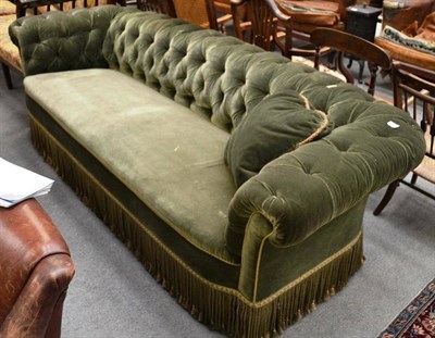 Lot 1596 - Chesterfield settee upholstered in green velvet, 235cm wide