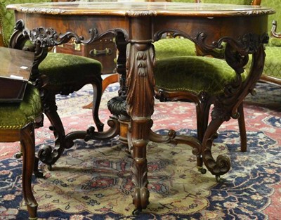 Lot 1606 - A 19th century North European mahogany centre table, of serpentine shaped form with...