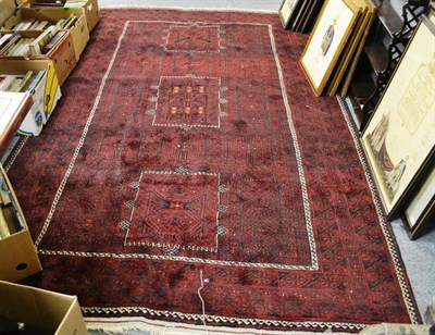 Lot 1617 - Belouch carpet, Persian Afghan frontier, the field of tribal and geometric motifs within three...