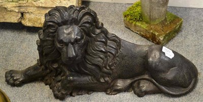 Lot 1629 - Victorian cast iron recumbent lion, 72cm wide