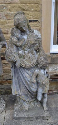 Lot 1649 - A carved stone garden statue of a lady with two children, height 140cm