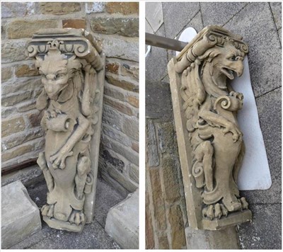 Lot 1652 - A pair of composition stone griffin mantel piece supports on bases height 134cm