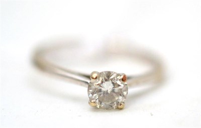 Lot 3 - An 18ct white gold diamond solitaire ring, the round brilliant cut diamond in a four claw...