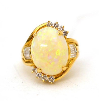 Lot 5 - A 14ct gold opal cocktail ring, the cabochon opal in a yellow four claw setting, with round...