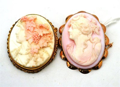Lot 8 - Two cameo brooches, both pinkish-white in colour, one carved to depict Diana the Huntress, one...