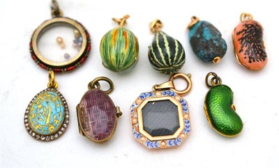 Lot 12 - Nine enamelled and gem-set charms, including two modelled as fruits, two lockets, one with seed...