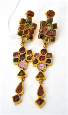 Lot 24 - A pair of tourmaline earrings, green and pink toned tourmalines set into long drops, with post...