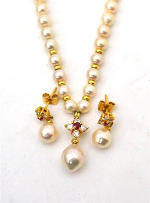 Lot 30 - A cultured pearl, diamond and ruby necklace, the uniform cultured pearls with roundel spacers...
