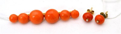 Lot 35 - A Victorian coral bar brooch, six beads of graduated size, length 6cm and a pair of coral and pearl
