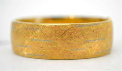 Lot 37 - A hinged bangle, of three coloured textured finish