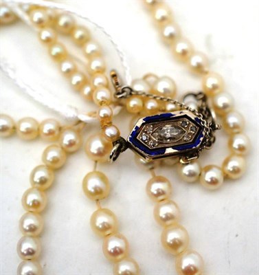 Lot 41 - A cultured pearl necklace, snapped, a strand of graduated cultured pearls to a lozenge shaped...
