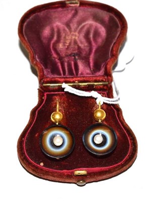 Lot 50 - A pair of sardonyx earrings, a bead suspends a dish shaped sardonyx with a pearl centre, hook...