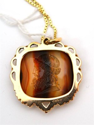 Lot 59 - A banded agate intaglio, in a decorative scroll, bead and granulated frame, on a box link...