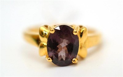 Lot 60 - An 18ct gold alexandrite ring, the colour change stone in a yellow claw setting, finger size N1/2