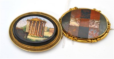 Lot 62 - A micro-mosaic brooch and a hardstone brooch, the micro-mosaic brooch depicting a temple, in a rope