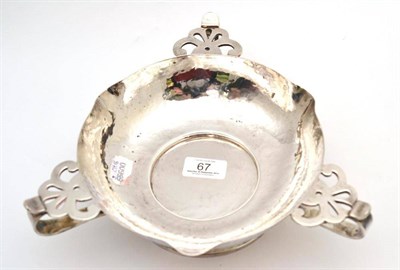 Lot 67 - An Edwardian Arts & Crafts silver three handled pedestal shallow bowl, London, 1903, (27cm wide...