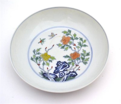 Lot 99 - A Chinese doucai style saucer dish, Yongzheng mark but not of the period, 13.5cm diameter