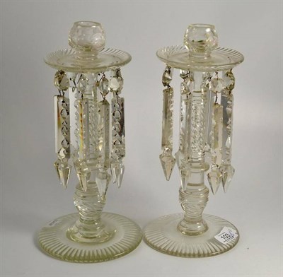 Lot 103 - Pair of glass lustre candlesticks, 32cm high and a pair of glass candlestciks 24cm high