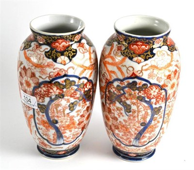 Lot 104 - A pair of Imari vases, Meiji period, of baluster form, 21.5cm high