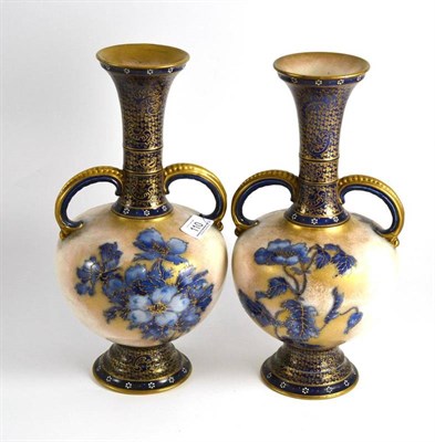 Lot 110 - A pair of late 19th century Doulton Burslem twin-handled vases, 32cm high