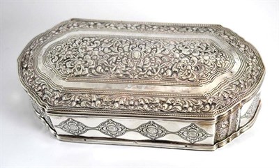 Lot 145 - An Indian white metal casket, the rectangular body profusely embossed with flower heads amongst...