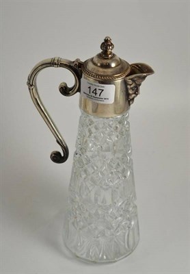 Lot 147 - A silver plated and moulded glass claret jug, 28.5cm high