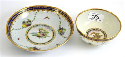 Lot 158 - A First Period Worcester tea bowl and saucer, decorated with exotic birds, insects and fruit...