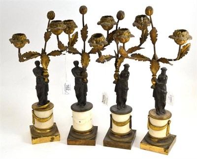 Lot 162 - A set of four bronze and ormolu figural candelabra, early 19th century, probably French,...