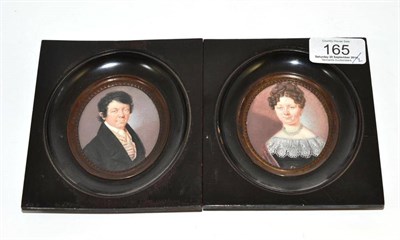 Lot 165 - A pair of early 19th century German miniature oval portraits, respectively of a gentleman and a...