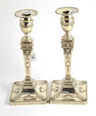 Lot 168 - A pair of Victorian silver candlesticks, in neo-classical style, Sheffield 1897, with...