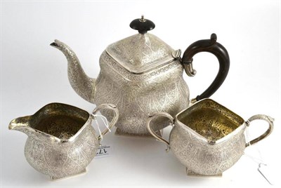 Lot 172 - An Indian white metal three piece tea service, comprising teapot, milk jug and sugar bowl, each...