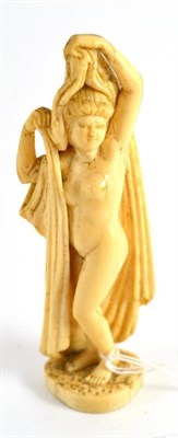 Lot 184 - An Indo-Portuguese ivory figure of a goddess, 19th century, standing holding loose drapes, 13cm...