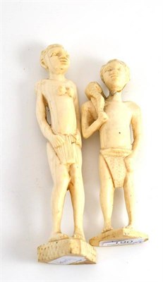 Lot 190 - A pair of early 20th century carved ivory African figures, 19cm high