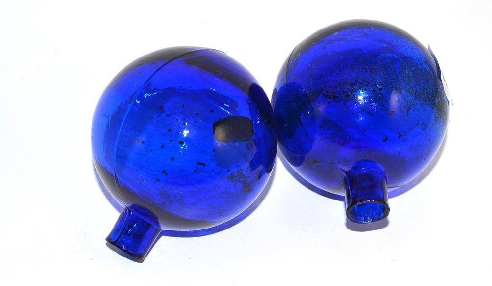 Lot 219 - A pair of ";Bristol"; blue glass target balls, 9.5cm high