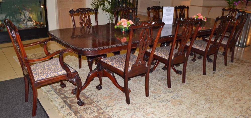 Lot 1742 - A mahogany triple pedestal dining table with acanthus columns and ball and claw feet, together with