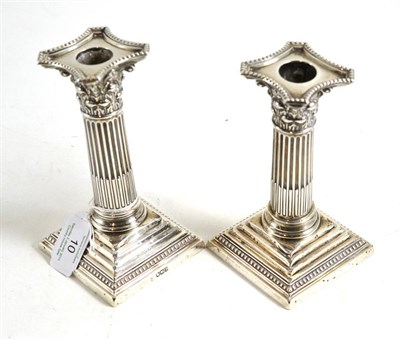 Lot 10 - A pair of George V silver candlesticks, Sheffield 1928, 16cm high