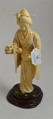 Lot 16 - ^ A late 19th century Japanese ivory figure, 28cm high