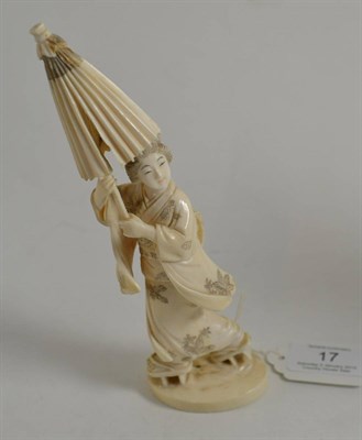 Lot 17 - A 19th century Japanese Meiji period carving of Bijin holding a parasol, 19cm high