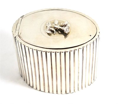 Lot 22 - A George III silver tea caddy with ribbed sides and floral finial (repaired hinge), London...