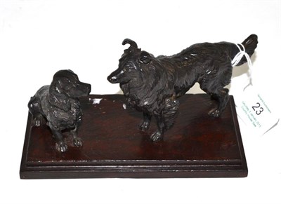 Lot 23 - Bronze group of two dogs, 16cm wide (base)