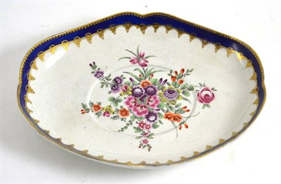 Lot 39 - First period Worcester porcelain sauce tureen stand, circa 1775, painted with flowers sprays,...