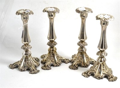 Lot 72 - Four silver plated candlesticks, 29cm high