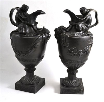 Lot 73 - A pair of black basalt ewers in the Manner of Flaxman, 40cm high