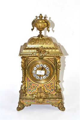 Lot 75 - A gilt metal striking mantel clock, circa 1890, urn finial and scroll decoration, 3-3/4-inch...