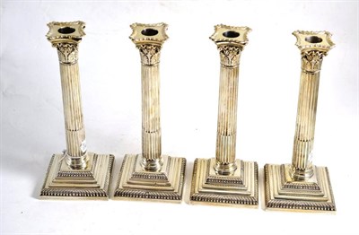 Lot 78 - A set of four silver Corinthian column candlesticks, 24cm high