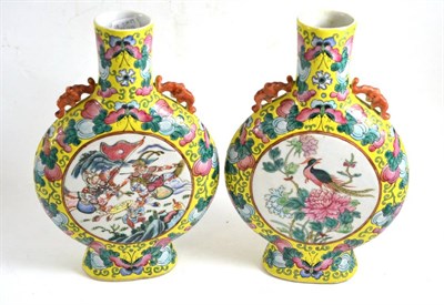 Lot 83 - A pair of late 19th century Chinese famille jeune porcelain moon flasks, 30cm high