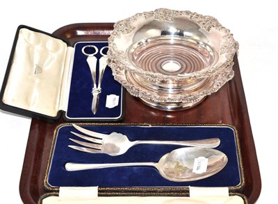 Lot 85 - Two silver plated bottle coasters, cased plated serving fork and spoon and a cased pair of...