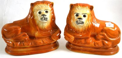 Lot 97 - Pair of Staffordshire lions with glass eyes, 29cm wide